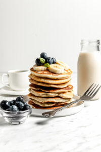 Healthy Cassava Flour Pancakes stacked with blueberries and banana