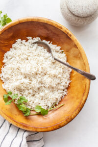 Instant Pot Basmati Rice in a wooden bowl with a serving spoon
