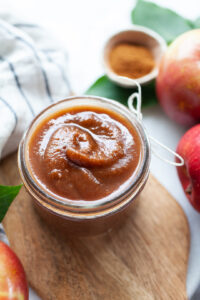 close up of instant pot apple butter in a small glass jar