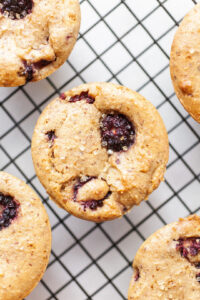 Close up of a Vegan Blackberry Muffin on a cooling rack